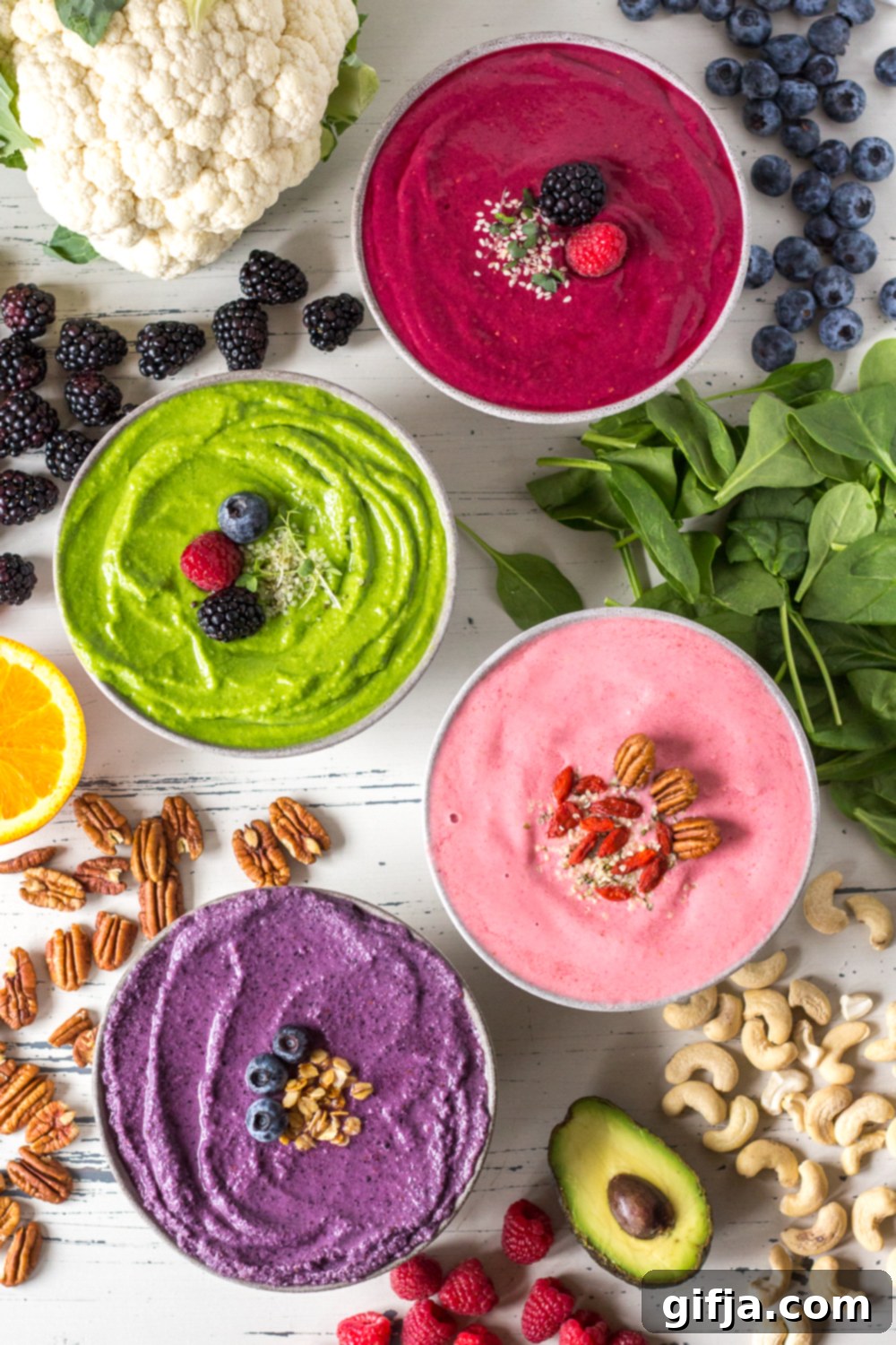 Colorful banana-free smoothie bowls with berries, nuts, and fresh toppings