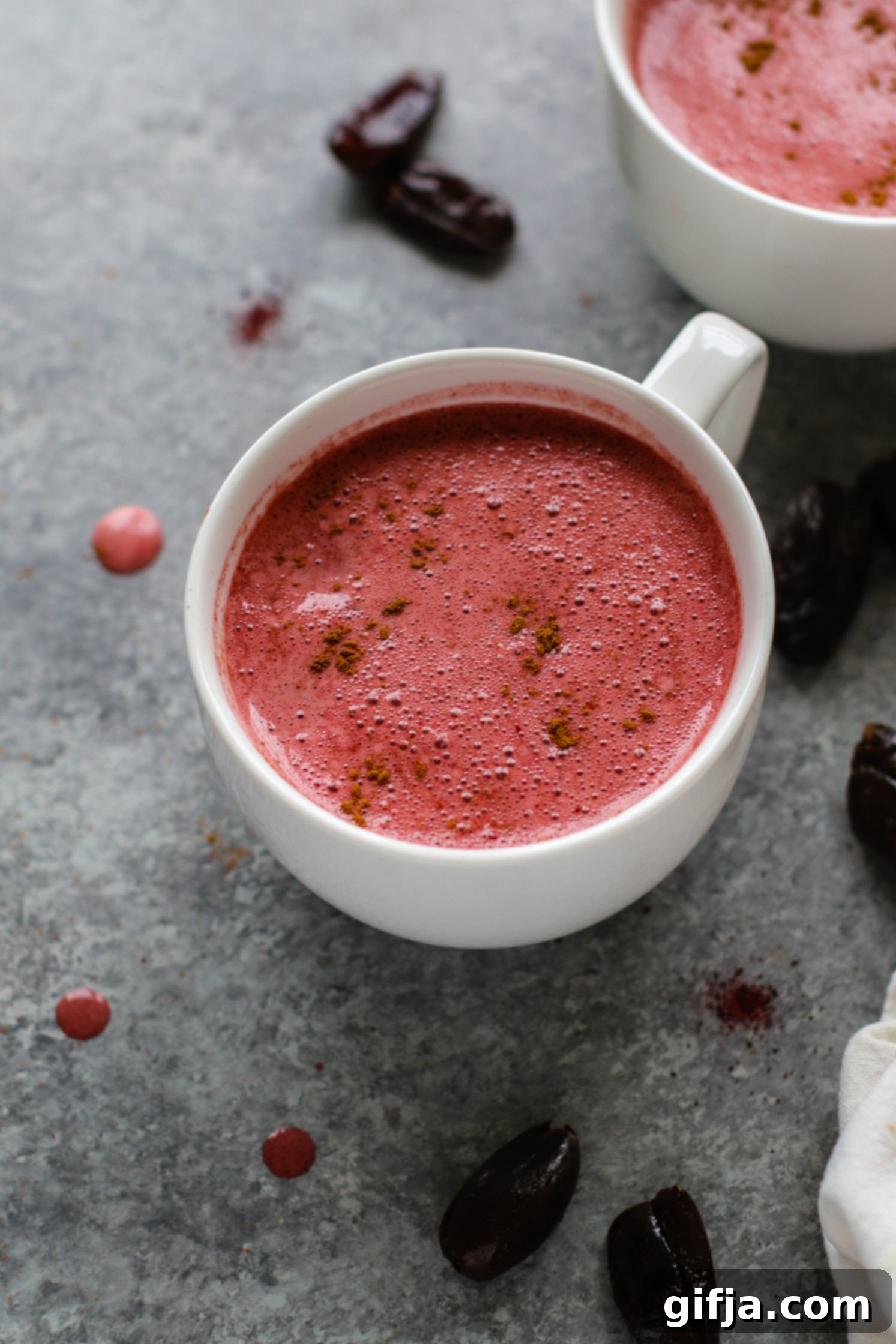 Date-Sweetened Beet Latte, vibrant pink, served in a cozy mug