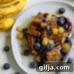 Ultimate Blueberry Banana French Toast Bake 9 A slice of Banana Blueberry French Toast Casserole with fresh blueberries and golden beets