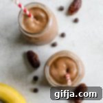 Guilt-Free Plant-Based Chocolate Frosty 7 Healthy Vegan Chocolate Frosty with red and white striped straws