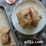 Artisan Cherry Almond Flour Pop-Tarts 13 Cherry Almond Flour Pop-Tarts, freshly baked and golden brown.