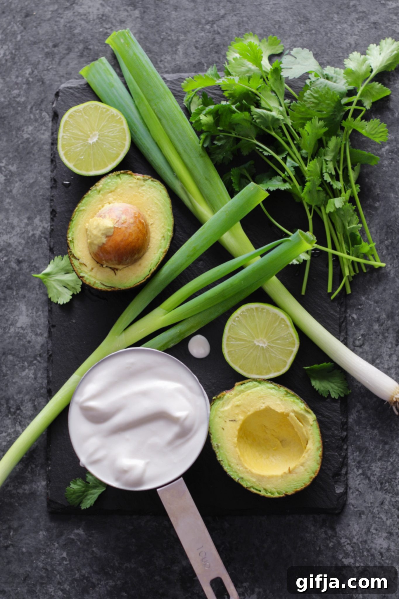 Effortless Vegan and Gluten-Free Ingredient Swaps 7 Various dips in bowls, including hummus, guacamole, and salsa, next to fresh vegetables.