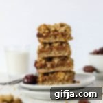 Sunshine Date Squares 10 SunButter Date Squares stacked on double plates, featuring the 5-ingredient recipe, by Flora & Vino