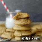 Snackable Cashew Chickpea Cookies 10 A close-up of a Cashew Butter Chickpea Snack Cookie, revealing its soft texture and inviting golden hue.