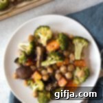 One-Pan Teriyaki Feast 9 Teriyaki Sheet Pan Meal with roasted chickpeas, broccoli, sweet potato, and mushrooms, drizzled with homemade teriyaki sauce.