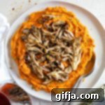 Pinot Noir's Dream Pairing: Sweet Potato Mash with Sautéed Mushrooms 11 Sweet Potato Mash with Sautéed Mushrooms served on plate with two spoons