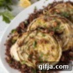Caramelized Cabbage Steaks 10 Roasted Cabbage Steaks served over quinoa with tahini, walnuts, and herbs
