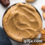 Creamy Tahini Date Indulgence 8 Tahini Date Caramel Dip in a bowl with Apple Chips and dates