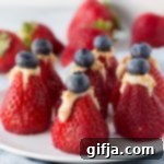 Cashew Cheesecake Stuffed Berry Bites 13 A top-down view of a single Cashew Cheesecake Stuffed Strawberry, ready for serving.