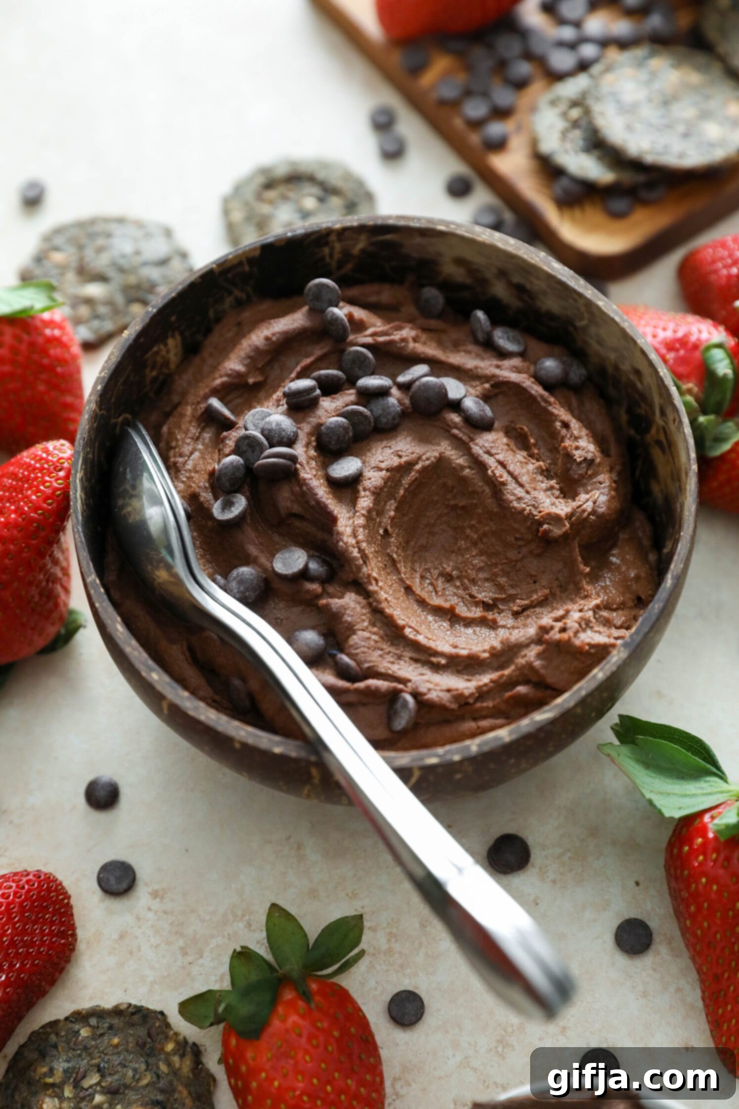 Vegan Brownie Batter Dip served in a bowl with spoons by Flora & Vino