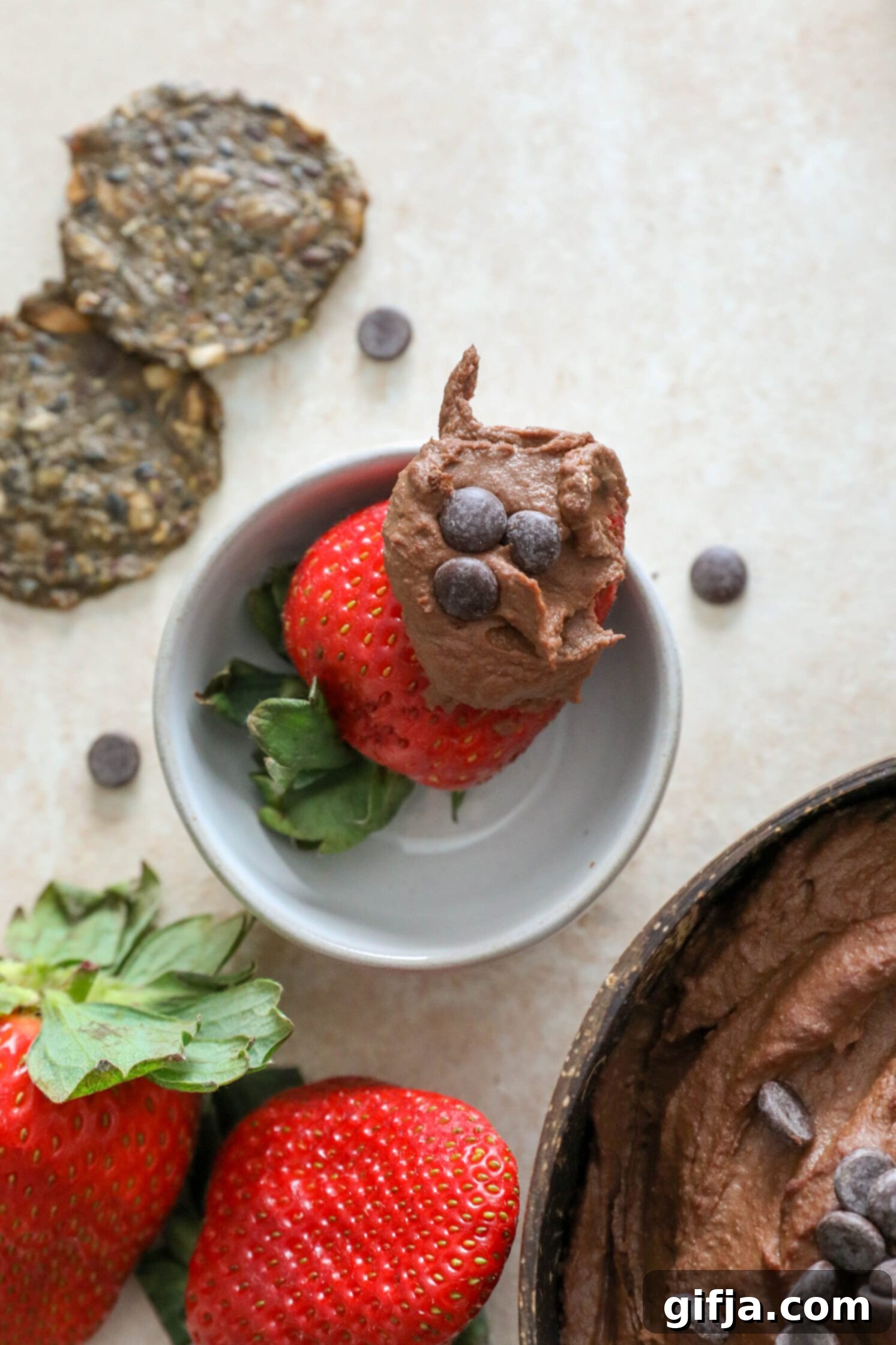 strawberry dipped with vegan brownie batter topped with chocolate chips by Flora & Vino 