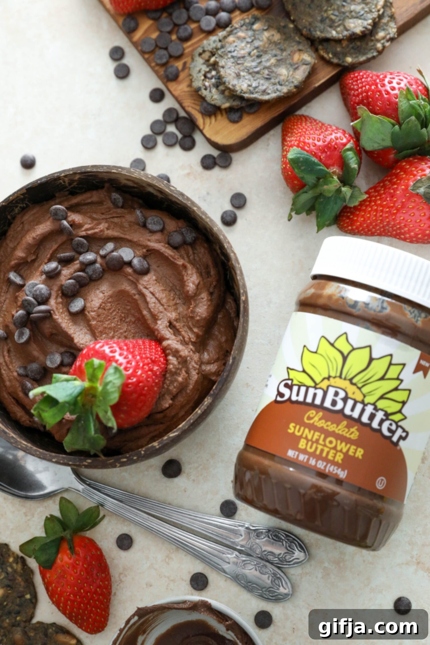 Vegan Brownie Batter Dip with strawberry dipped in by Flora & Vino