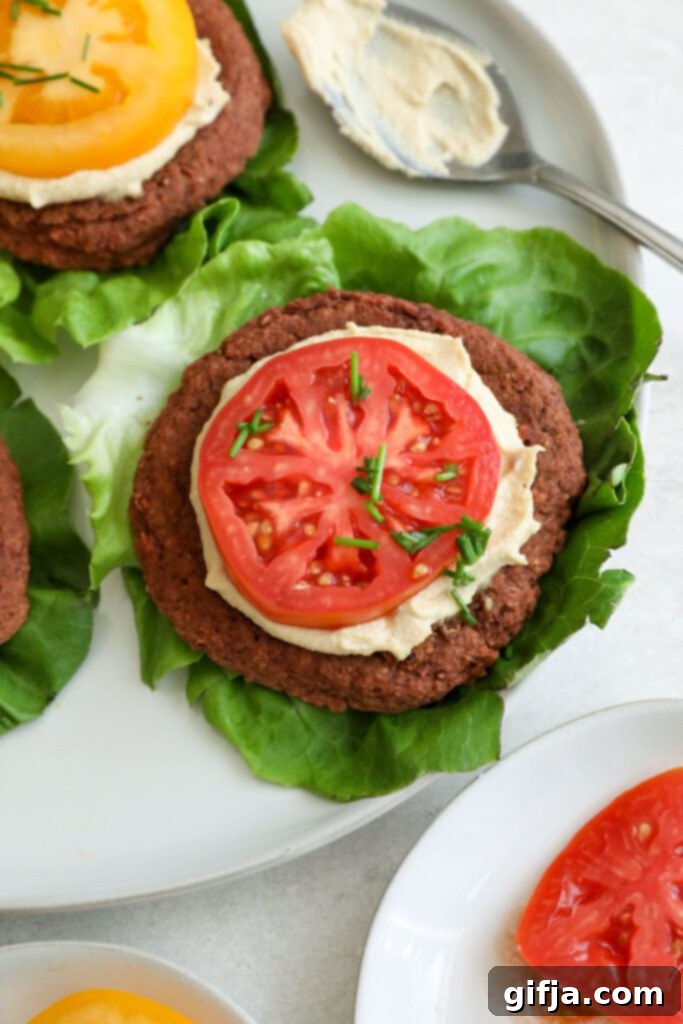 Vibrant Beet & Smoky White Bean Veggie Burgers 11 A freshly baked Smoky White Bean & Beet Burger, vibrant in color, perfectly cooked and ready to be enjoyed, showcasing its appealing texture and rich hues.