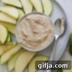 SunButter Yogurt Delight 12 SunButter Yogurt Dip in a small white bowl with a spoon