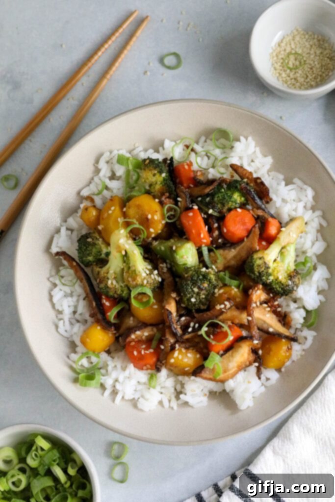 Vibrant Sesame Shiitake & Broccoli Stir-Fry served over fluffy jasmine rice, garnished with fresh green onion and toasted sesame seeds, with chopsticks ready on the side – a delightful plant-based meal by Flora & Vino.