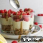 No-Bake SunButter Cheesecake Bites 12 Delicious SunButter Cheesecake Cups with fresh raspberries, ready to serve.