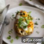 Hearty Veggie Twice Baked Potato 16 Close-up of a Veggie Loaded Twice Baked Potato, garnished with fresh dill and green onion