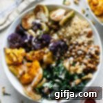 Vibrant Paprika Power Bowl with Zesty Apple Cider Tahini 9 A vibrant Paprika Power Bowl with roasted vegetables and tahini dressing in a white bowl.