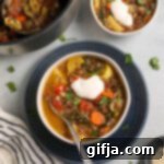 Hearty Vegetable Quinoa Medley 13 Vegetable Quinoa Stew served on plate with almond milk yogurt and fresh herbs