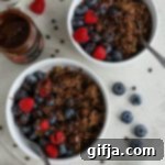 Decadent Chocolate Quinoa Breakfast 12 Delicious chocolate quinoa porridge, topped with fresh berries and dark chocolate chips, making a perfect healthy breakfast.