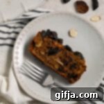 Plant-Based Holiday Fruit Cake 12 A slice of Vegan Holiday Fruit Cake on a plate