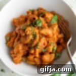 Velvety One Pot Vegan Pasta 10 Creamy Vegan 1-Pot Pasta served in a bowl with a fork with fresh basil and vegan parmesan