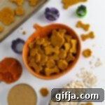 Homemade Pumpkin Peanut Butter Dog Treats 12 Close up of a homemade Pumpkin Peanut Butter Dog Treat, showcasing its rustic texture and inviting color.
