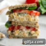 Plant-Powered Chickpea Sandwich 12 Vegan Chickpea Salad Sandwich on a plate with lettuce and tomato