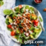 Hemp Heart Ranch-Drizzled BBQ Chickpea Power Salad 8 BBQ Chickpea Salad served in a bowl, with dressing