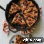 Cozy Sweet Potato Breakfast Skillet Cookie 9 A slice of Sweet Potato Breakfast Skillet Cookie in a cast iron skillet