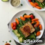 Sunshine Orange Ginger Tofu Soak 8 A plate of baked orange ginger tofu with fresh orange slices