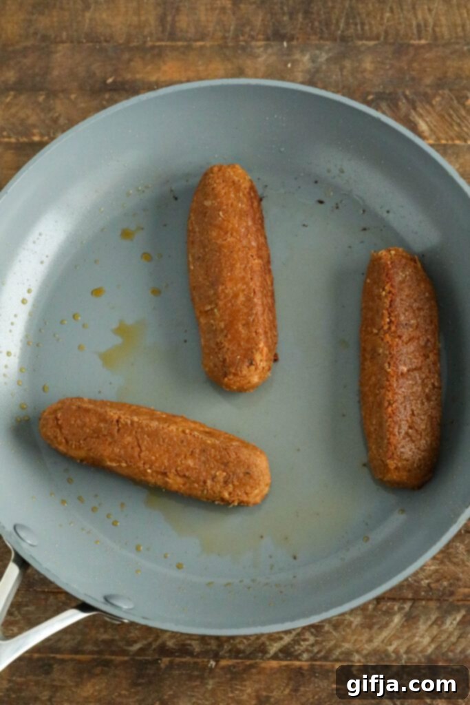 vegan bratwurst in cooked in pan 