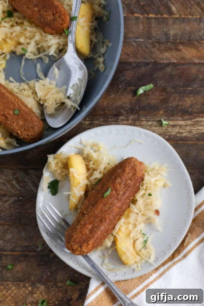 Vegan Bratwurst with Sauerkraut on plate with fork