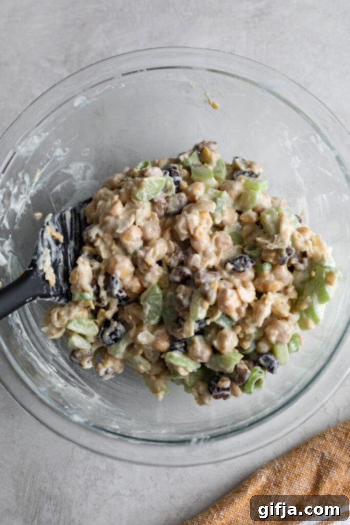 Mixed cranberry chickpea salad in a large bowl, showing all ingredients