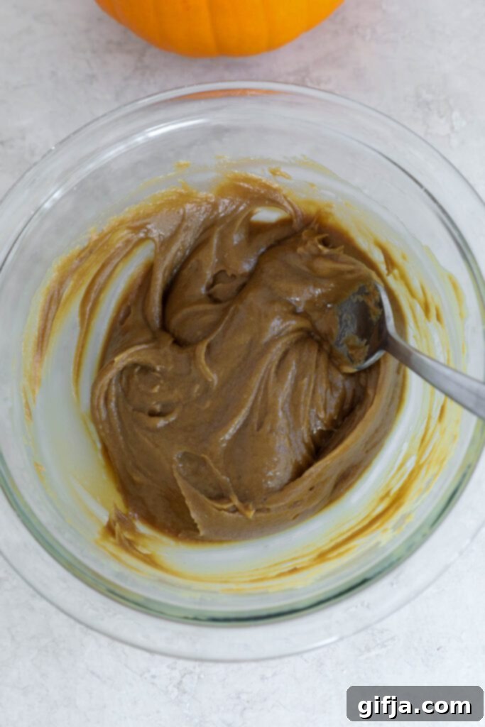 Spiced Pumpkin Cheesecake with Silky SunButter Frosting 9 SunButter frosting mixed together in bowl, showing smooth, creamy texture