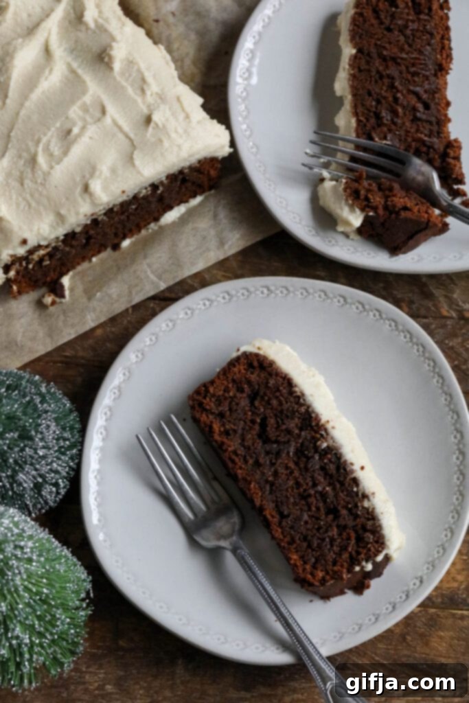 Applesauce Spice Cake 4 Applesauce Gingerbread Loaf topped with vegan cream cheese frosting served on plates with forks