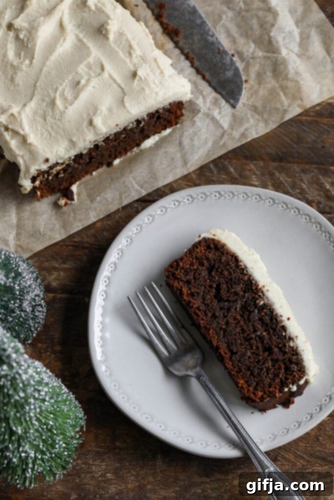 Applesauce Gingerbread Loaf served on plate with fork