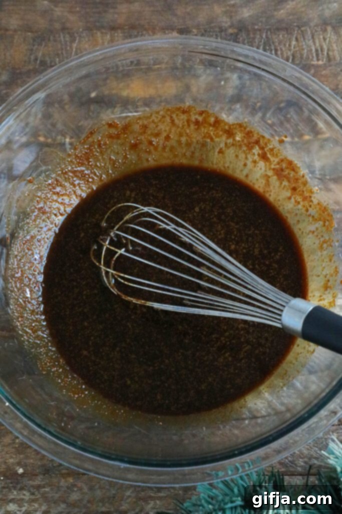 wet ingredients for gingerbread loaf in mixing bowl